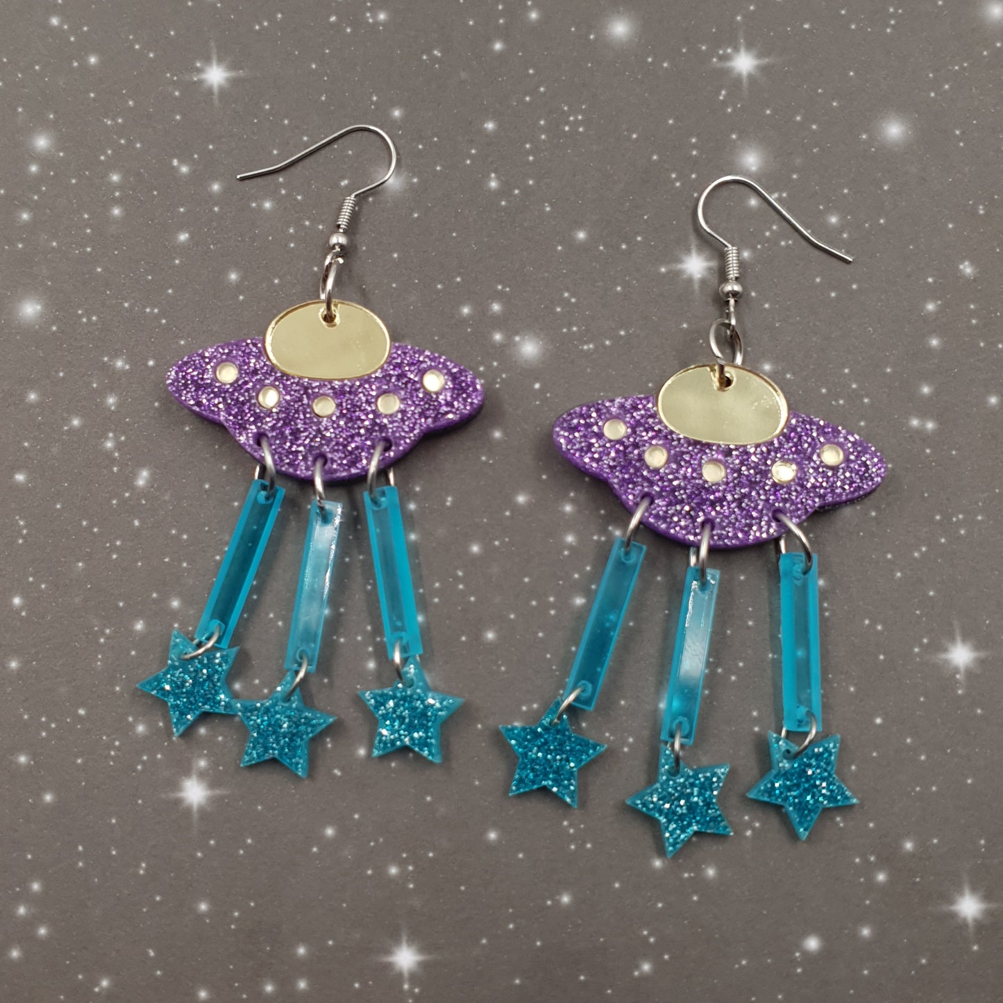 Space ship earrings glitter